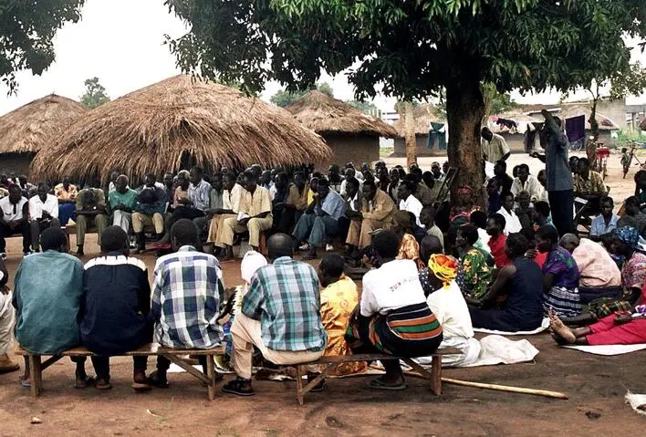 community gathering waiting onto their grants.