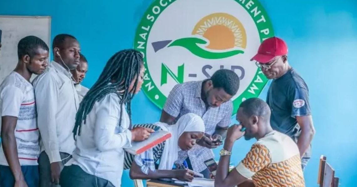 Image of a group of young Nigerian volunteers participating in the N-Power initiative, receiving training and skills development opportunities.