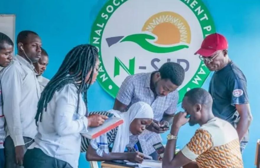 Image of a group of young Nigerian volunteers participating in the N-Power initiative, receiving training and skills development opportunities.