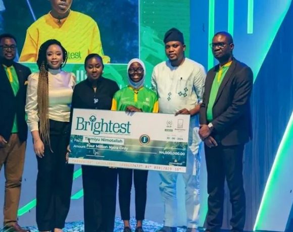 A 15-year-old student from Ogun State, Nimotallah Tiamiyu, proudly holding her award for winning the 2024 Brightest National Agric Science Quiz Contest.