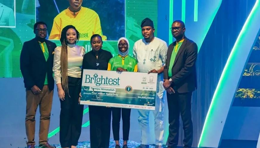 A 15-year-old student from Ogun State, Nimotallah Tiamiyu, proudly holding her award for winning the 2024 Brightest National Agric Science Quiz Contest.