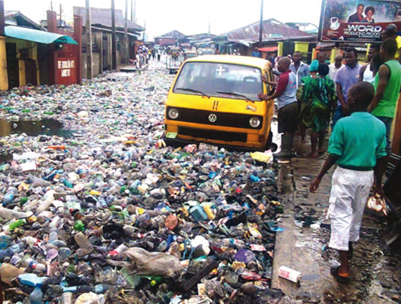 A busy Lagos street littered with waste, highlighting the need for improved sanitation practices.