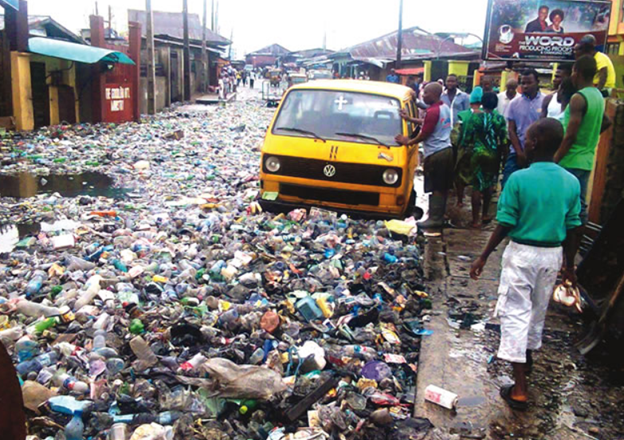 A busy Lagos street littered with waste, highlighting the need for improved sanitation practices.