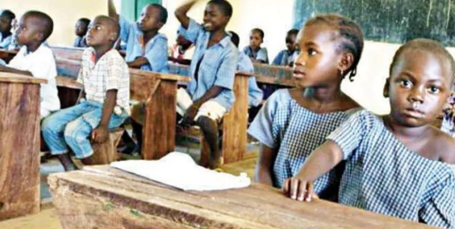 A classroom in Nigeria with children learning, highlighting the importance of improving primary education infrastructure.