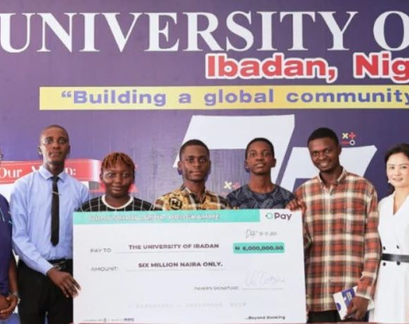 Image of a joyful university student holding books, symbolizing academic success and opportunities through the OPay scholarship.