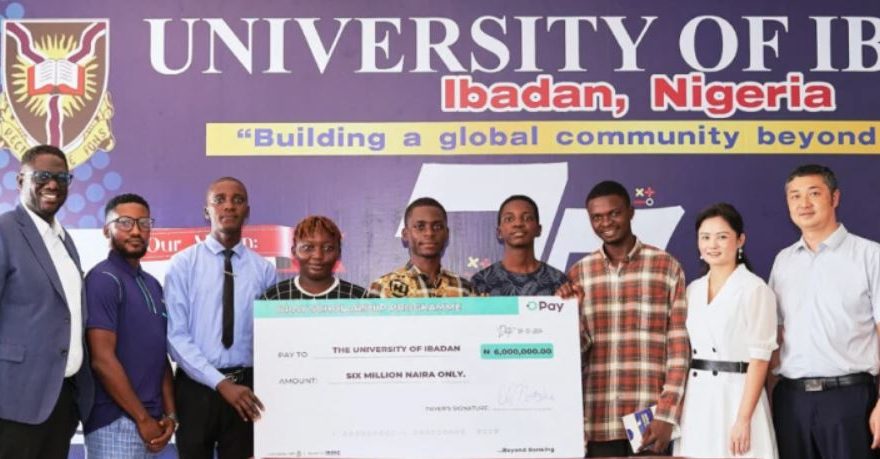 Image of a joyful university student holding books, symbolizing academic success and opportunities through the OPay scholarship.